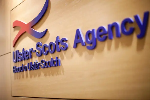 Ulster Scots Agency logo on a wall